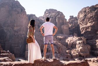 Well dressed couple looking at landscape in Jordan Things for couples to do in Jordan