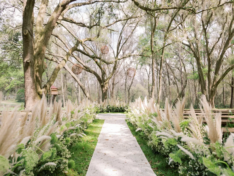 Dreamy waving fronds of pampas grass set the tone for this boho wedding.