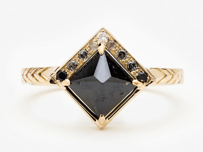 This Art Deco engagement ring is sure to bring the wow factor with a square black diamond beside ombré diamonds.