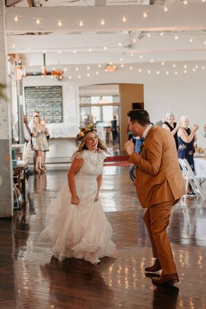 Bride in Lace Dress and Flower Crown, Groom in Orange Suit Dancing into Bohemian Reception