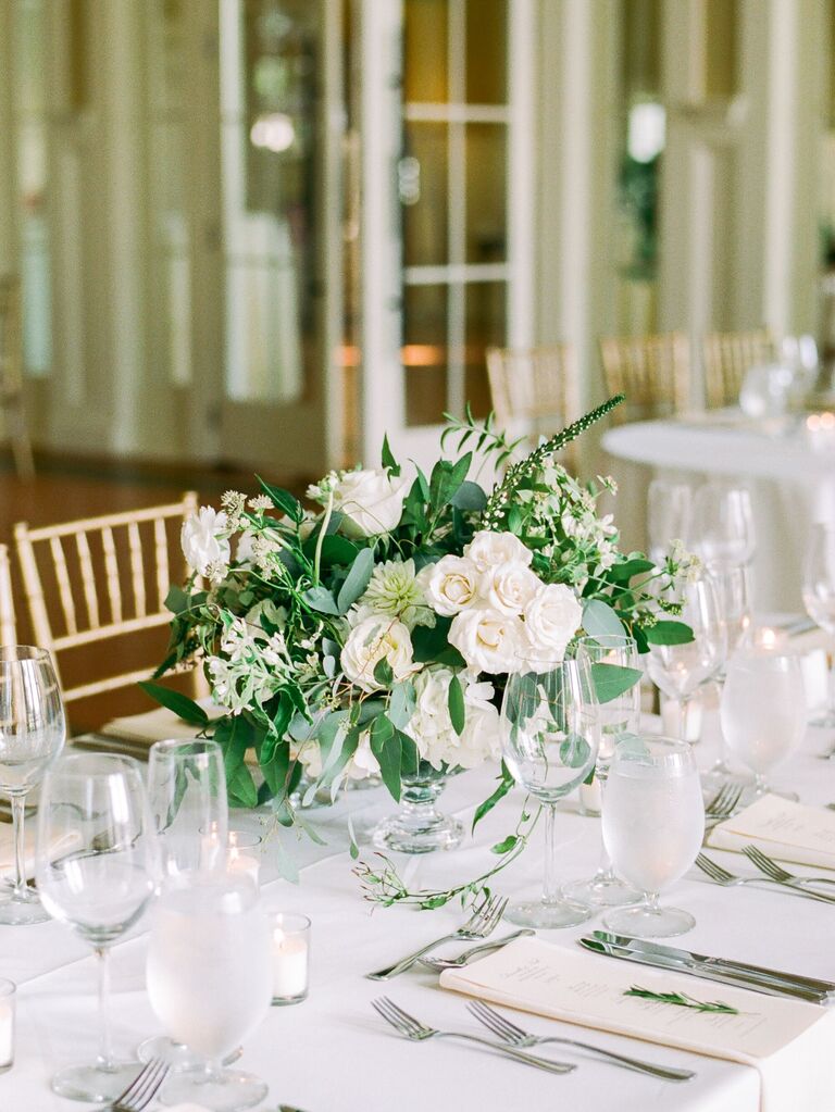 classic wedding centerpiece with white roses and eucalyptus