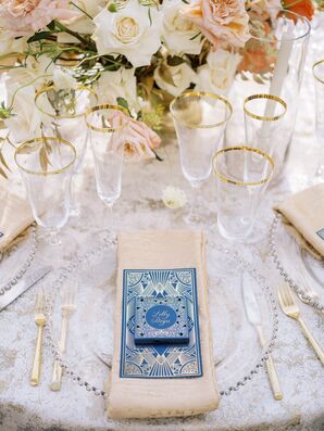 Blue-and-Gold Menu Atop Glass Charger at Place Setting