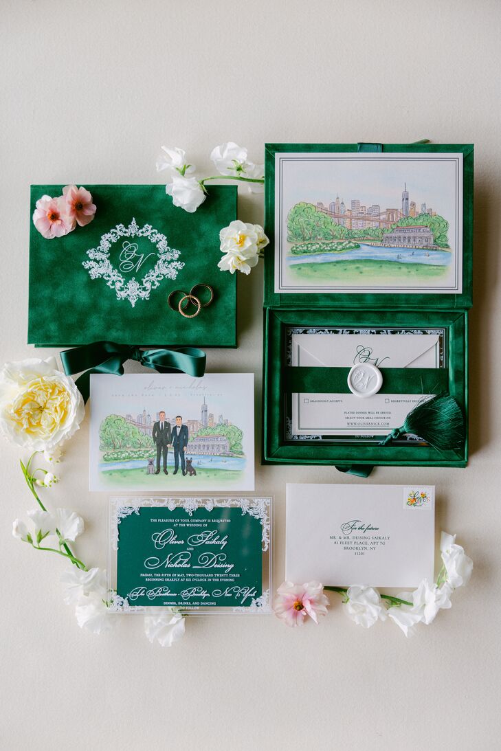 An emerald-green-and-white invitation suite with custom illustrations of the NYC boathouse venue, the grooms and their digs, in addition to elegant details and a wax seal.