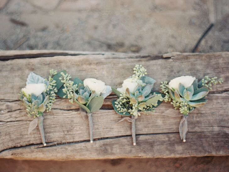 The groomsmen accessorized with delicate white and green boutonnieres.