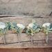 The groomsmen accessorized with delicate white and green boutonnieres.