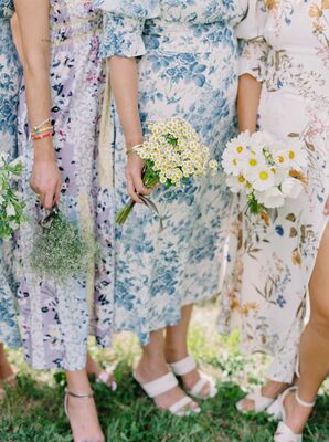 Bridesmaids in Multicolored Floral Dresses With Different Wildflower Bouquets