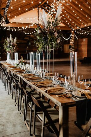Rustic Wedding Reception With Farm Tables, String Lights and Arrangements of Pampas Grass
