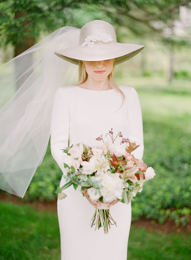 Drawing inspiration from her mother's 1970s bohemian wedding look, Sarah wore a custom Houghton gown and a similar veiled, broad-brim hat.