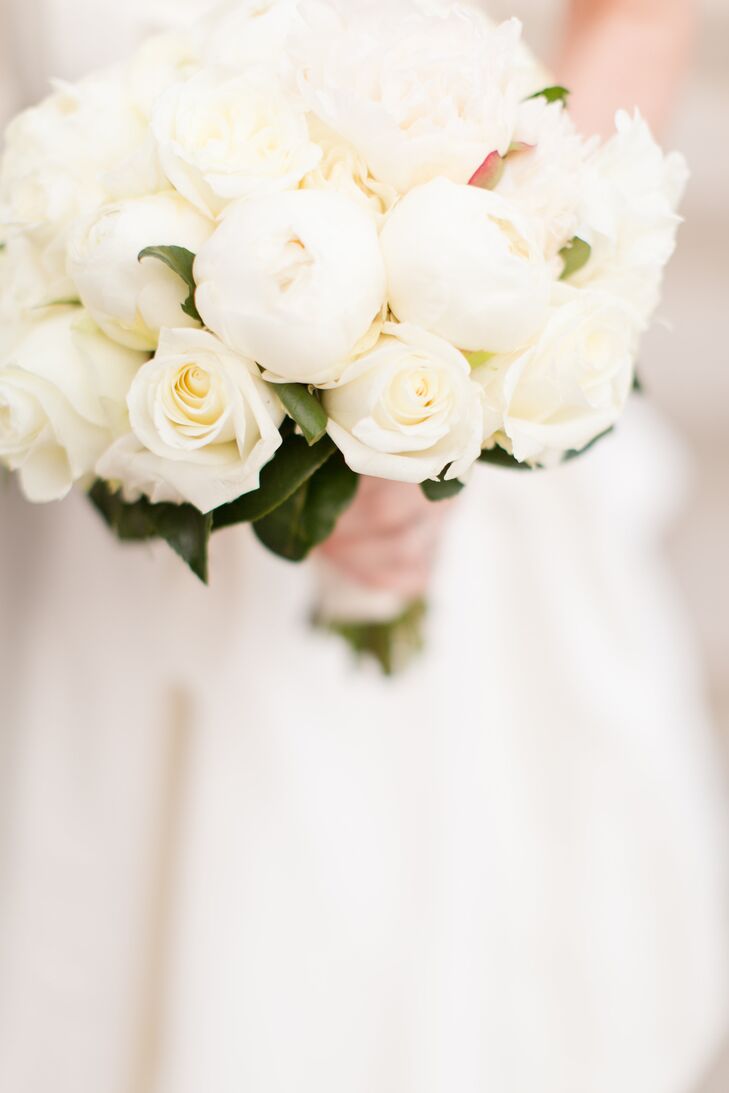 Lindsay carried a simple bouquet of white peonies and some roses. Peonies were not in season during the time of her winter wedding, so her florist imported them from New Zealand.