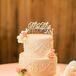White Wedding Cake With Piping and Pink Flowers