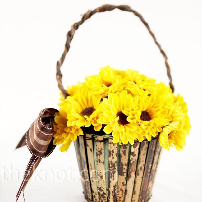 The flower girl carried sunflowers, of course, in a faded-wood basket decorated with brown ribbon.