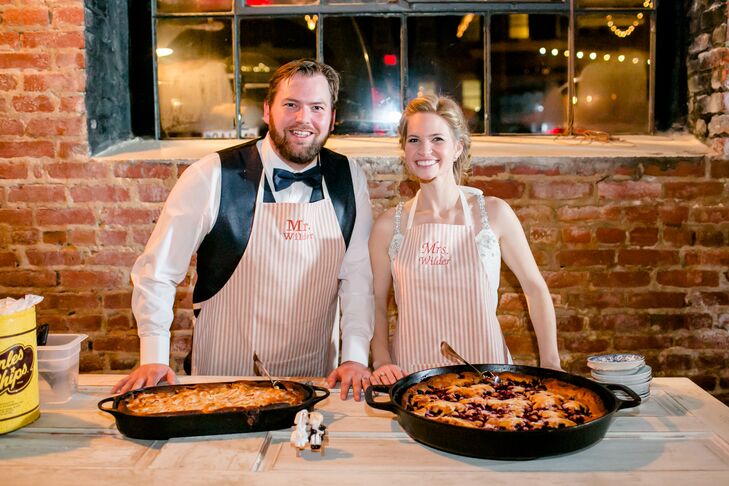 Rather than serve wedding cake, Maggie and Doug had two giant cast-iron skillets filled with blackberry and apple cobbler. They served guests themselves, clad in aprons with "Mr. Wilder" and "Mrs. Wilder" printed on them. “It was so special to just slow things down, serve our guests and share that extra moment with them,” Maggie says. “Oh, and we didn’t take those aprons off for a while. I think we danced three songs with them on.”