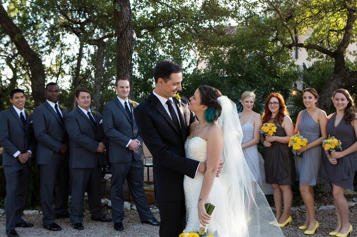 The groomsmen wore dark gray suits and David wore a black tuxedo.