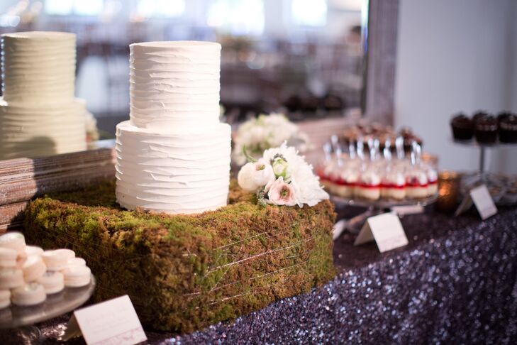 Even the delicious dessert display got in on the Irish-inspired theme. The couple’s two-tier cutting cake was displayed atop a simple stand covered in rich, textured moss and full, romantic blooms.