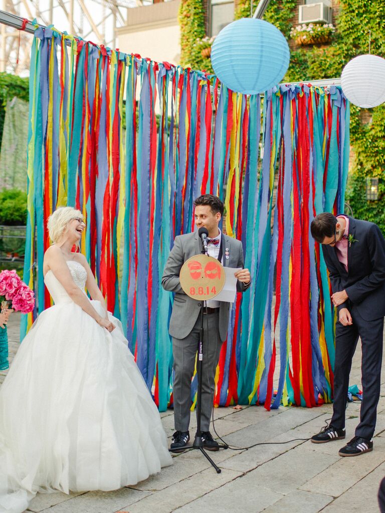 Colorful ribbon backdrop at an outdoor ceremony