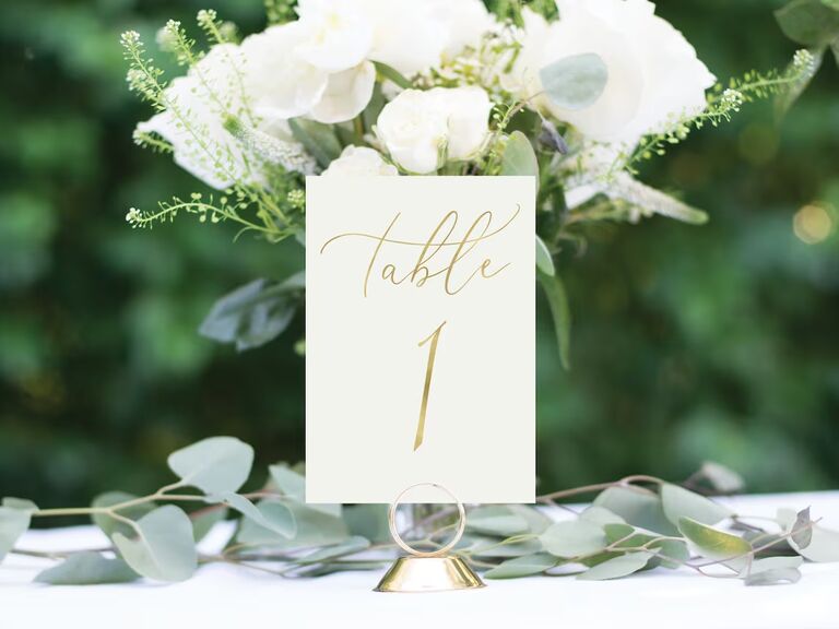 classic elegant wedding table number idea with gold calligraphy on white card