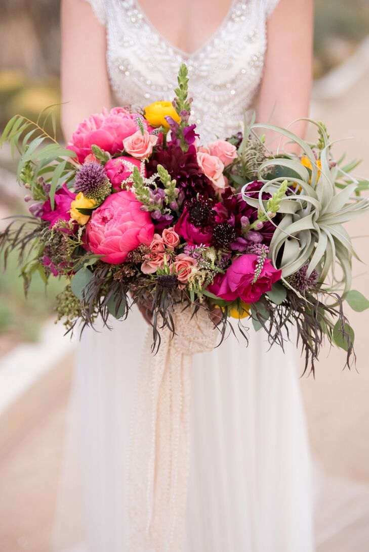 Florist Layers of Lovely crafted Jenna's vibrant bouquet, which was a wild, lively combination of air plants and colorful blossoms.