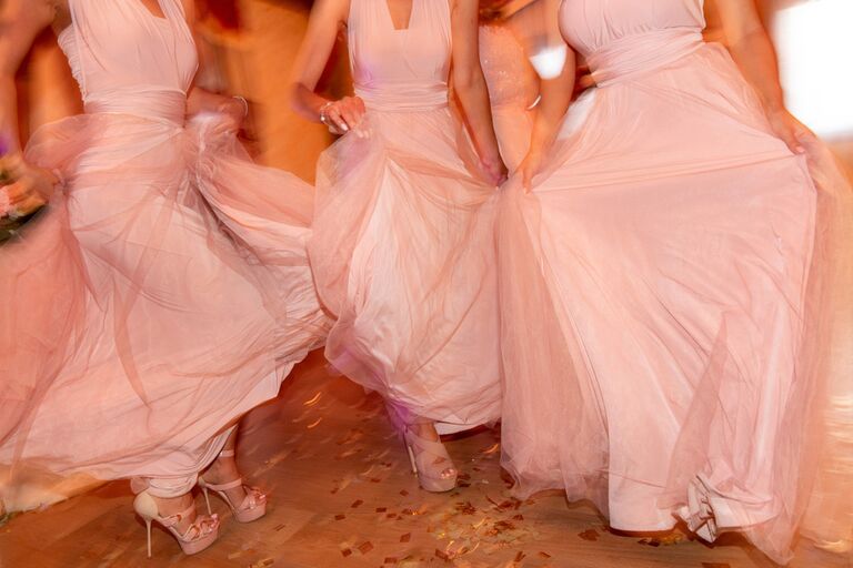 Bridesmaids dancing to upbeat wedding entrance song