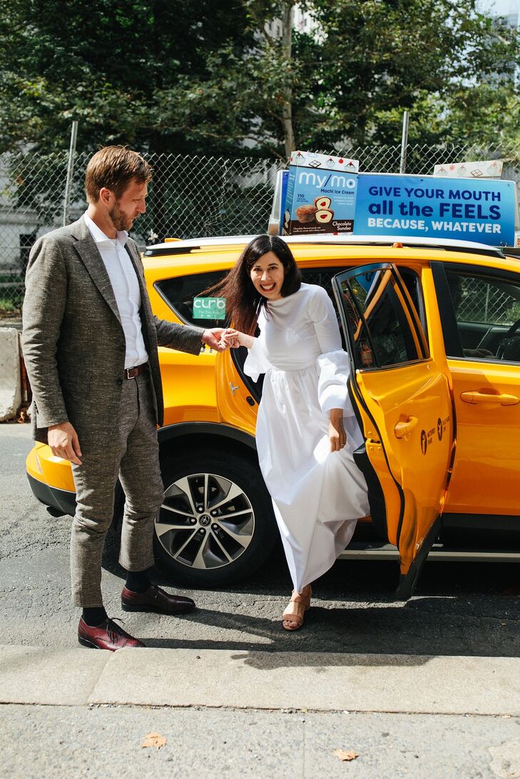 Casual Couple with Gray Suit, Modern Wedding Dress and New City York Taxi