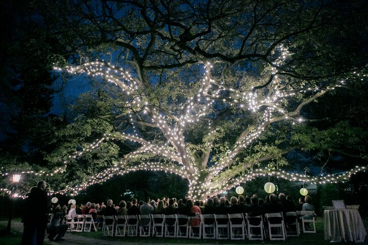 Joelle and David had an outdoor garden ceremony under a big tree decorated in fairy lights and strung with lanterns. The effect was magical.