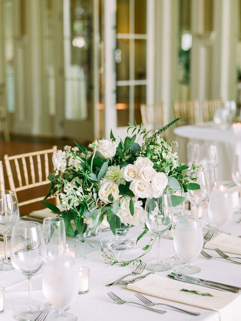 elegant greenery wedding centerpiece with white roses
