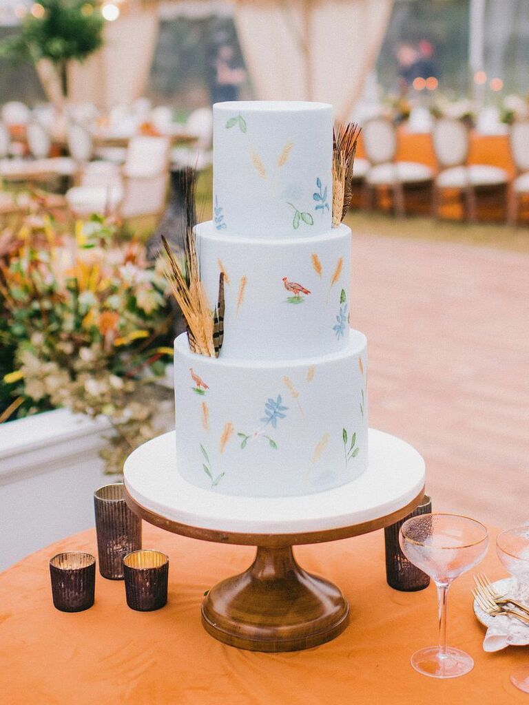 modern rustic fall wedding cake with hand-painted birds and flowers on fondant tiers