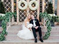 wedding couple sitting on church steps