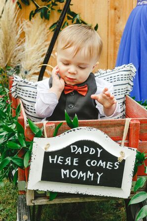 Son in Wagon with Custom Sign