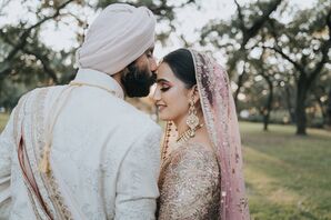 Groom in Sherwani, Turban Kisses Bride With Pink Veil on Forehead