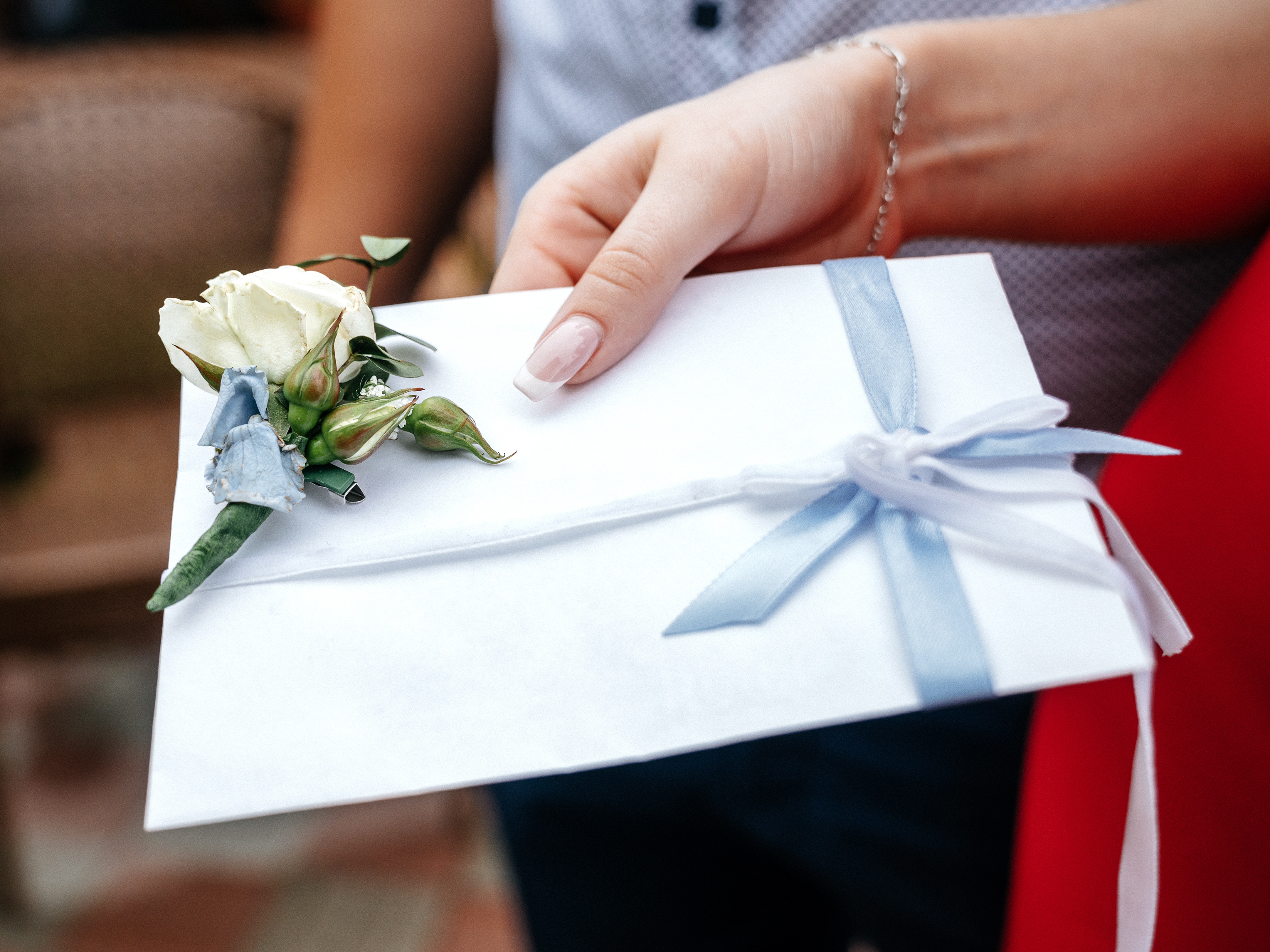 woman carrying wedding card
