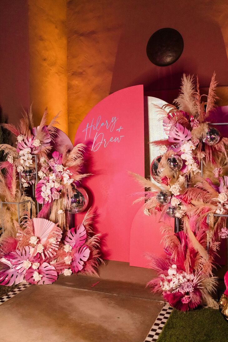 Ceremony Arrangement Converted to Pink Photo Backdrop With Disco Balls, Painted Palm Leaves