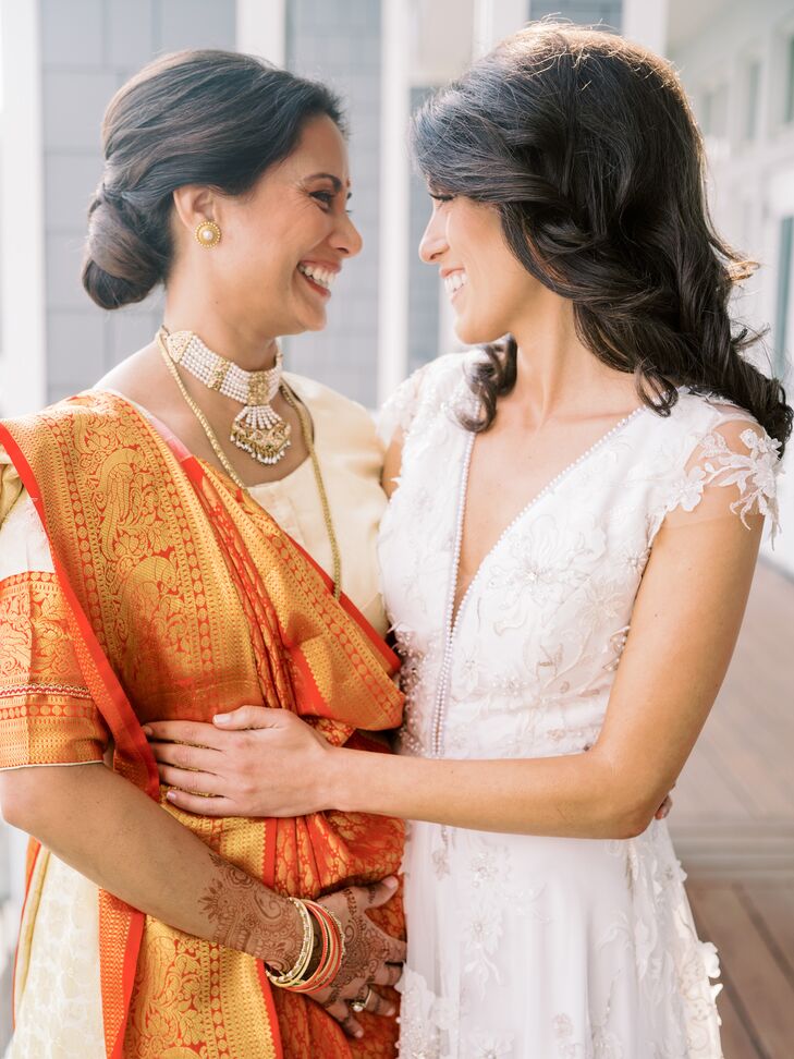 Brides Smiling at Each Other During Wedding Pictures