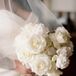 Bride in Fitted Dress, Natural Makeup and Down Hairstyle on Hotel Bed