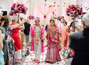 Jessica and Rahul wanted their two-part wedding to be both colorful and cohesive, Jessica says. Take their stationery suite: Each piece was printed on