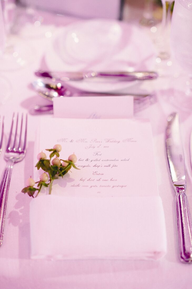 Clean and simple white menu cards were accented by fresh sprigs of berries.