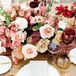 Rose Centerpieces and White-and-Gold Place Settings