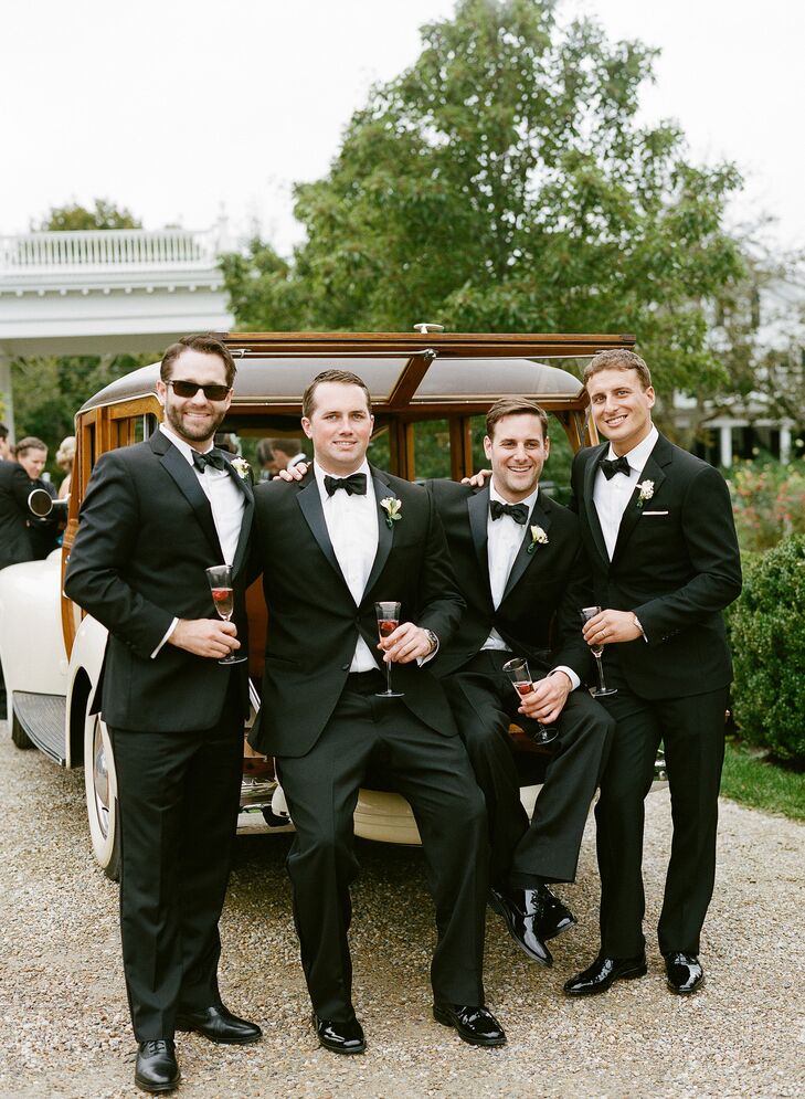 Nicholas and his groomsmen took the classic route when it came to their wedding day attire. He donned a sleek Ralph Lauren Black Label tuxedo and customized cufflinks with the nautical coordinates of St. Elizabeth’s Church and each of his groomsmen wore a complementary style. To thank the guys for all of their support, Nicholas gifted each of them with black enamel and sterling cufflinks in the shape of Martha’s Vineyard from C.B. Stark in Edgartown.