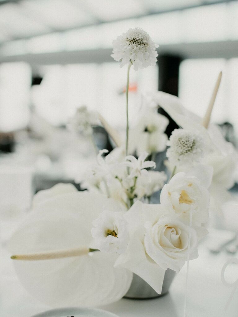 simple wedding centerpiece with white roses, scabiosa, and anthurium in ikebana style arrangement