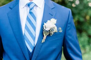 Groom in Blue Suit with Striped Tie and Blue Thistle Corsage