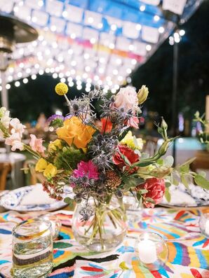 Low, Boldly Colorful Centerpieces in Clear Vase on Vibrant Table Linen, Mexican Patterns