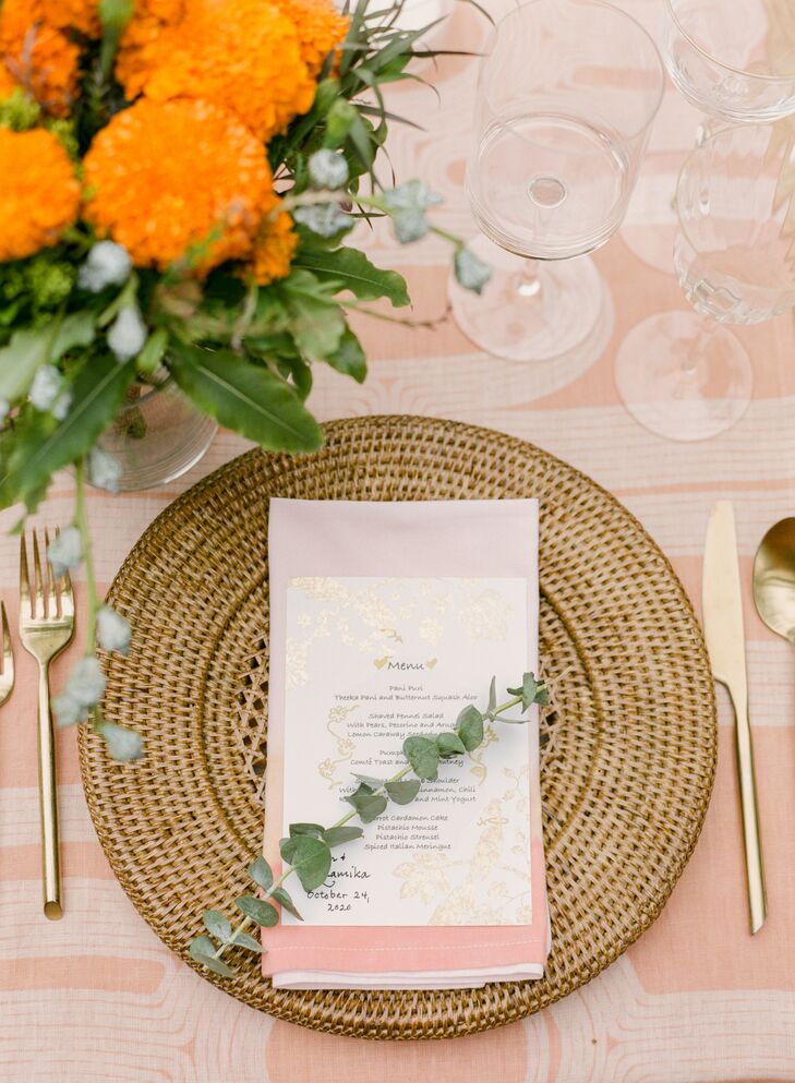 Simple Place Setting With Peach Linen and Wicker Charger