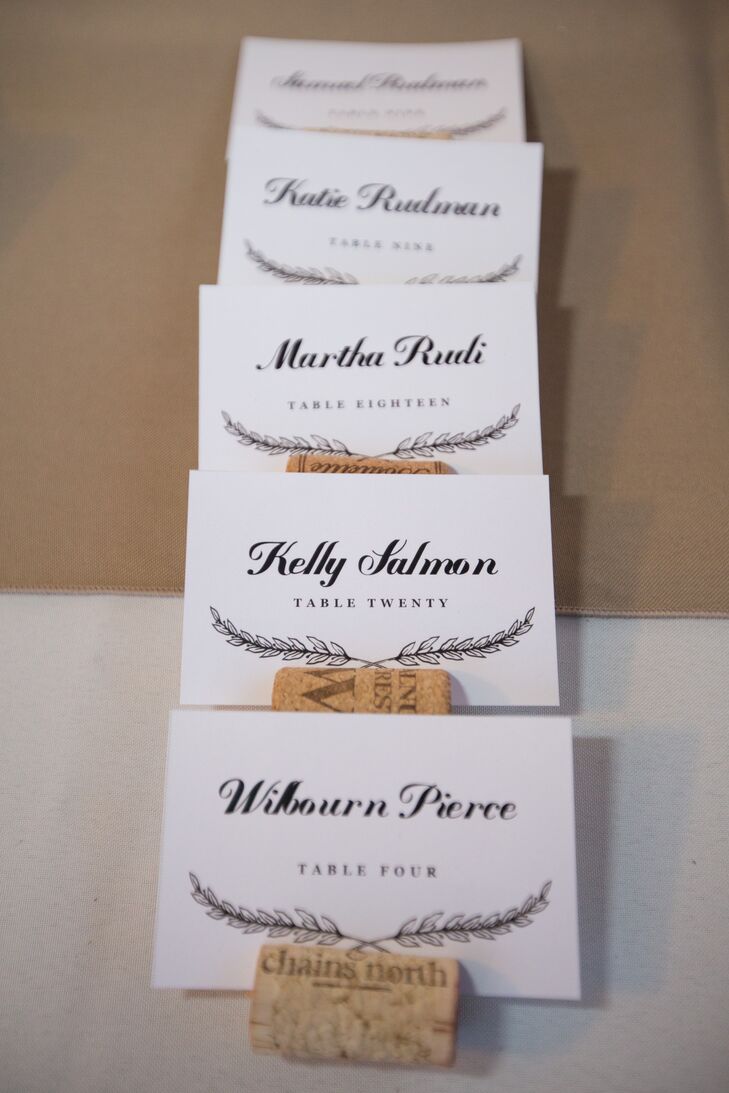 The escort cards were printed by Cards of Wood on walnut wood veneer and came with corkboard holders.