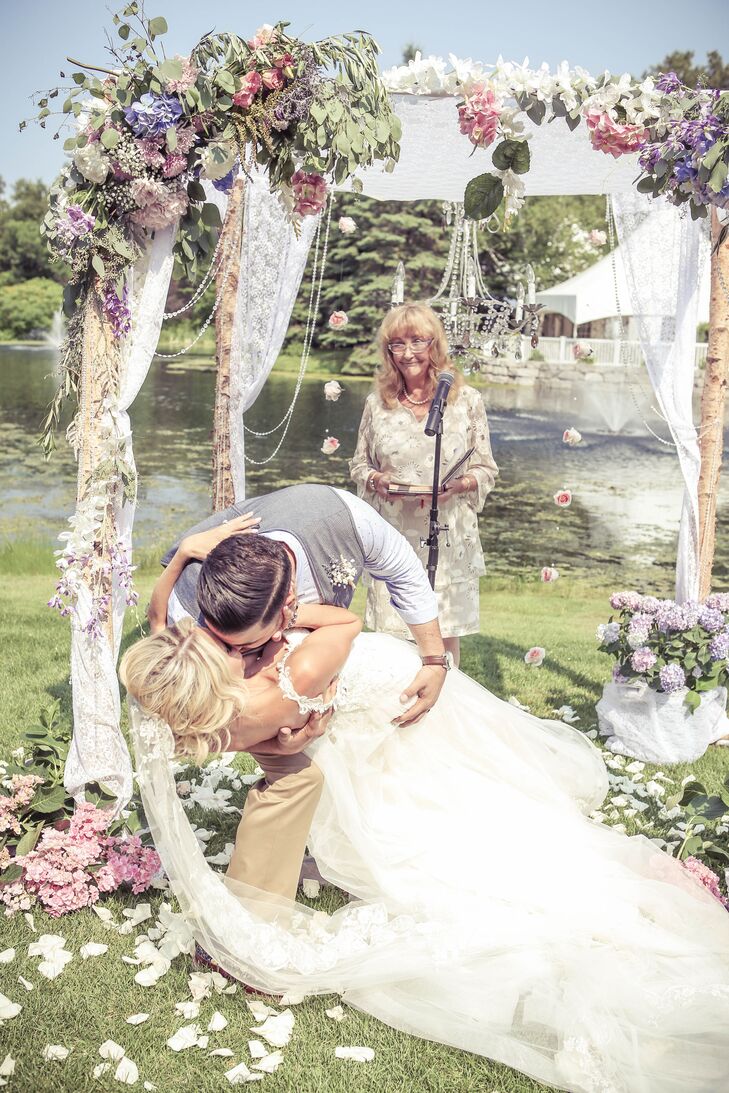 The couple exchanged vows underneath a custom-made birch-branch chuppah covered in pastel flowers.