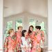 Before donning their vibrant coral J.Crew dresses for the ceremony, Hannah’s bridesmaids got primped in glamorous satin robes. Playing off the garden-party theme and cheerful palette, the robes were decorated in a bright floral motif and a warm coral hue.