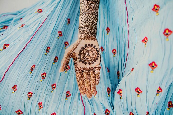 A symbol of health and good luck, the women sported traditional mehndi designs on their hands for the celebration. The tradition says that the darker the mehndi on the bride's hands, the more her groom loves her.