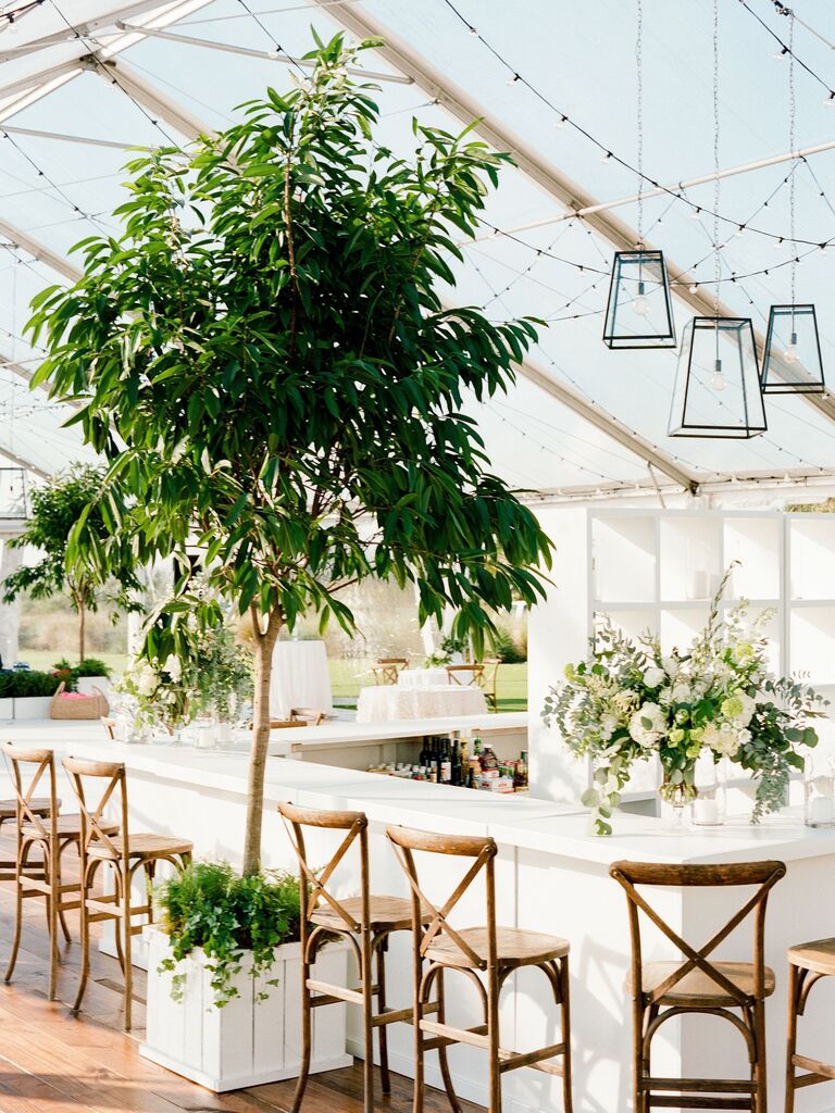 Palm tree accents on outdoor bar top for wedding reception