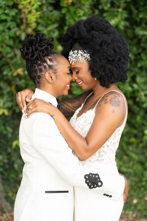 Brides Hugging During Wedding at Clay Theatre in Jacksonville, Florida
