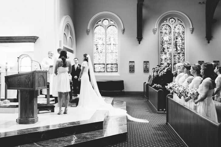 Two large vases filled with lush, white blooms flanked either side of the altar at the Church of St. Mary. "I was baptized there and Matt was confirmed at that church, so it's very meaningful to both of our families," Anna says.