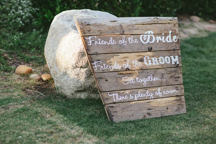 Rustic distressed wood signs leading into the ceremony encouraged Madison and Brent's guests to mix and mingle.