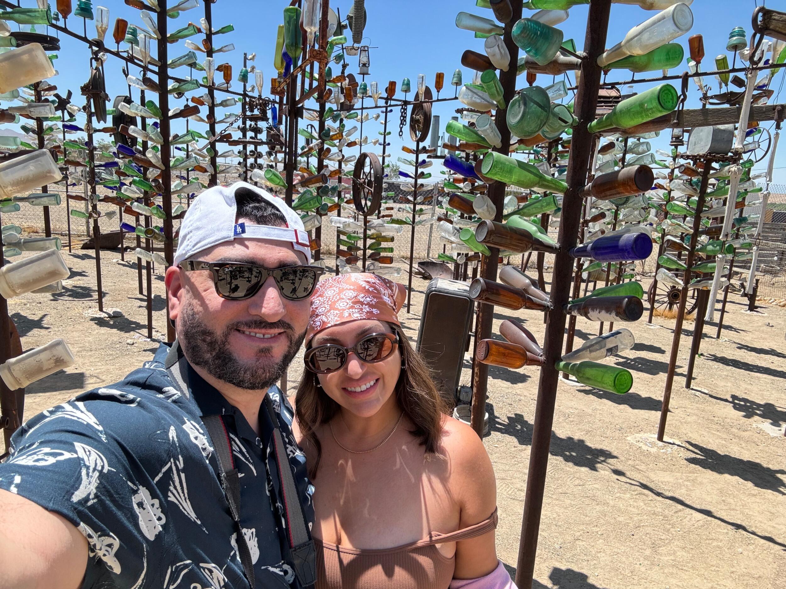Fabian: "One of my favorite things about us is how we road trip. She always finds the best little adventures along the way—like Elmer's Bottle Tree Ranch."